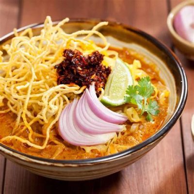  Khao Soi: Un plat qui embaume l'Asie du Sud-Est avec ses saveurs sucrées et épicées, un voyage culinaire mémorable!